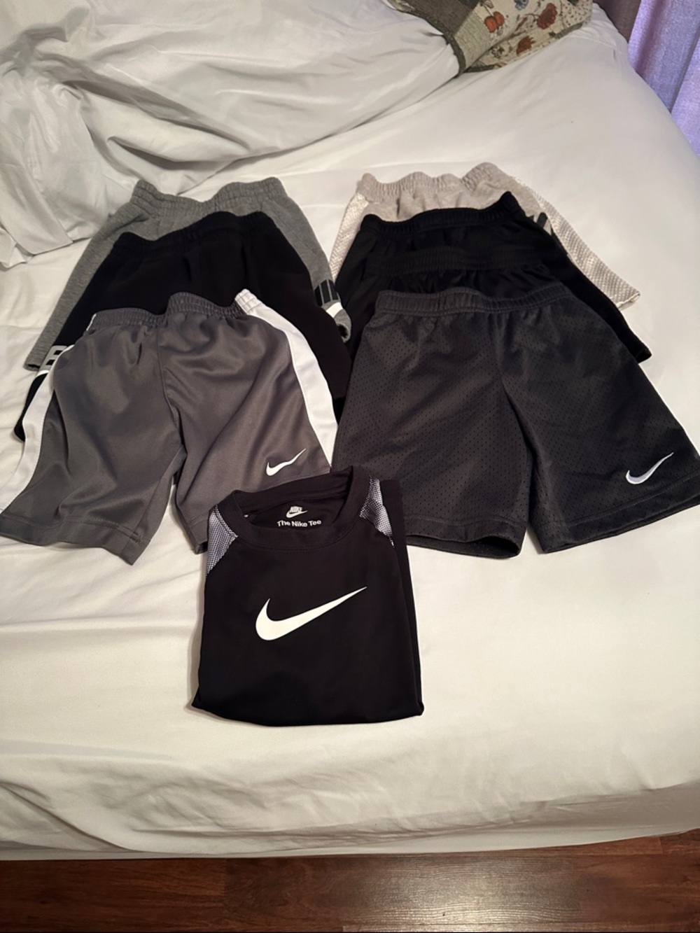 Nike Black Short-Sleeve Athletic Tee with White Swoosh and Patterned Sleeves